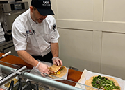 A VCS chef prepares entrees at the Creation Station concept in St. Louis